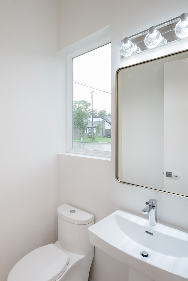 bathroom with sink and toilet