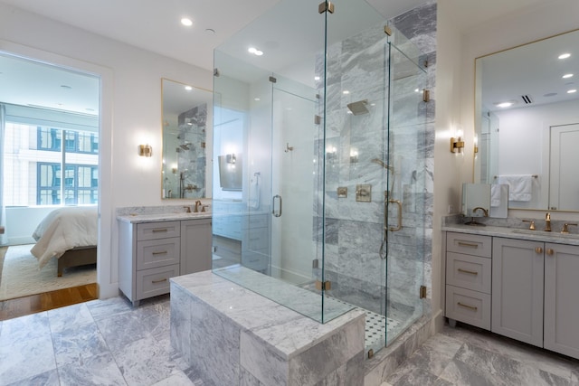 bathroom with vanity and an enclosed shower