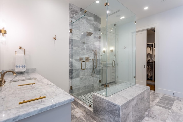 bathroom featuring vanity and an enclosed shower