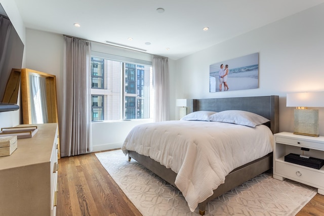 bedroom with light hardwood / wood-style flooring