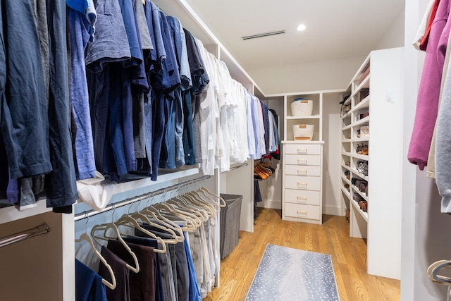 spacious closet featuring light hardwood / wood-style flooring