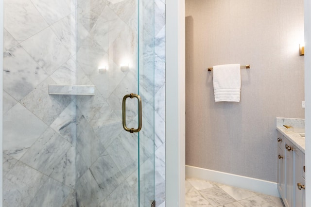 bathroom with walk in shower and vanity