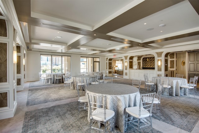 dining space with coffered ceiling and beam ceiling