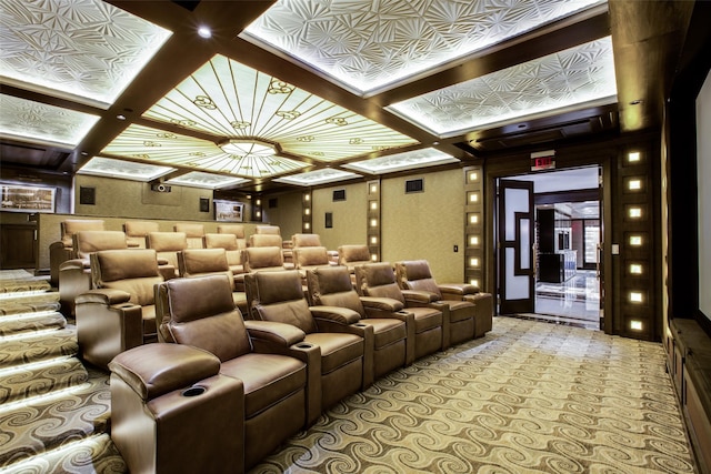 cinema room with light carpet and coffered ceiling