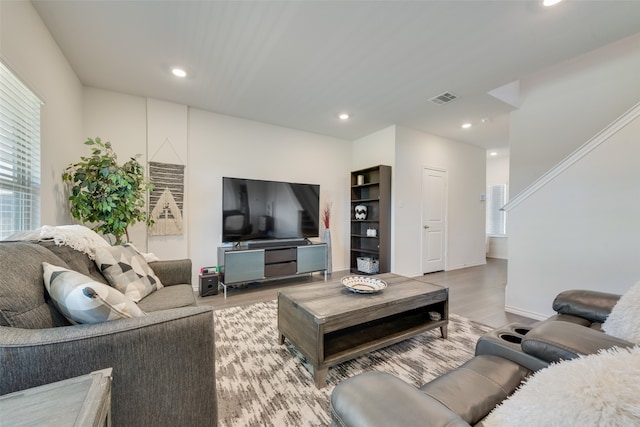 living room with light hardwood / wood-style floors