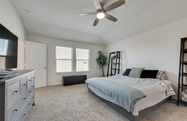 carpeted bedroom with lofted ceiling and ceiling fan