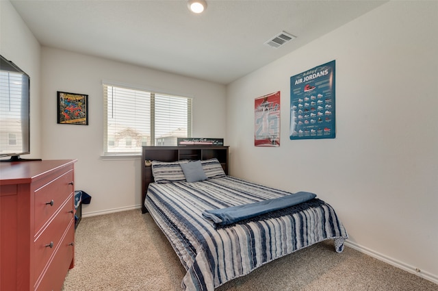 bedroom with light carpet