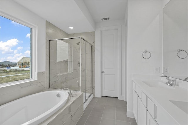 bathroom with vanity, tile patterned flooring, and independent shower and bath