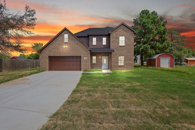 view of front facade with a lawn and a garage