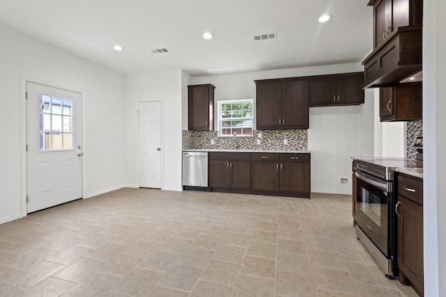 kitchen with backsplash, dark brown cabinets, light tile patterned flooring, and stainless steel appliances