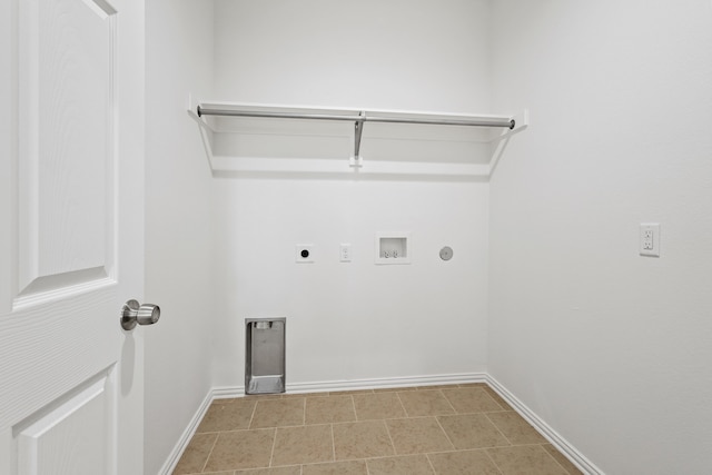 laundry area featuring washer hookup, electric dryer hookup, and light tile patterned flooring