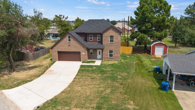 view of front of home with a storage unit, a garage, and a front lawn