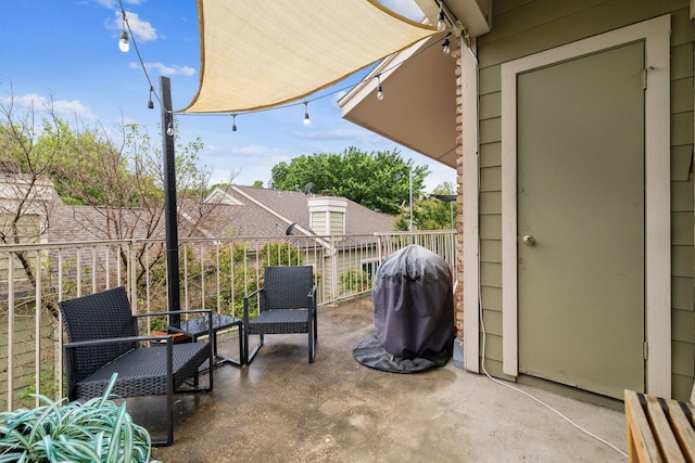 view of patio / terrace with a balcony and area for grilling