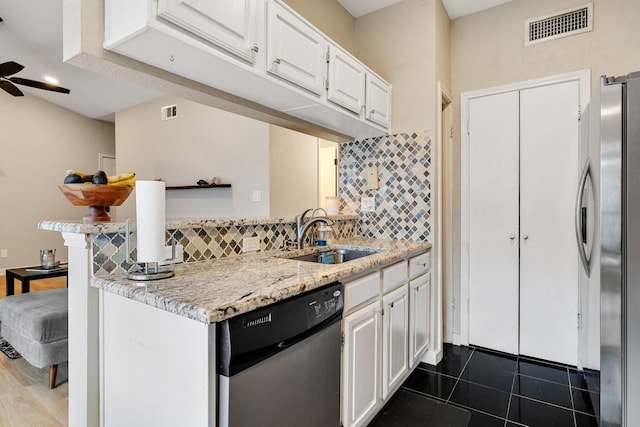 kitchen featuring ceiling fan, sink, white cabinetry, and appliances with stainless steel finishes