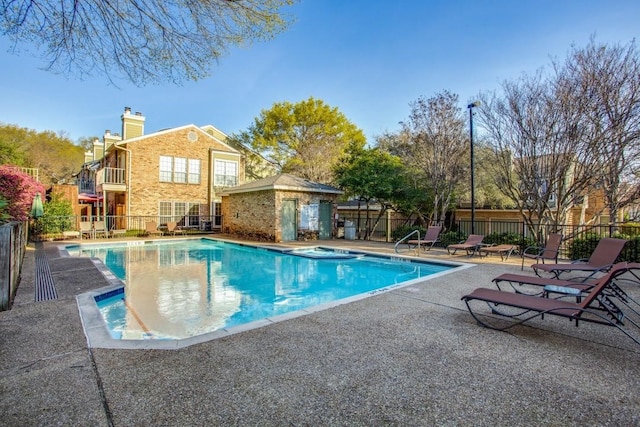 view of swimming pool with a patio