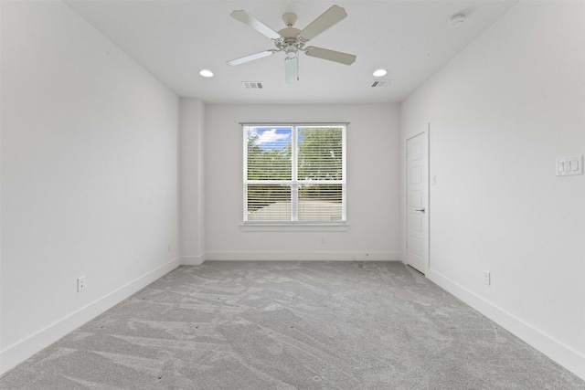 carpeted empty room with visible vents, recessed lighting, baseboards, and ceiling fan