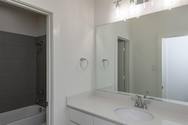 bathroom featuring vanity and tiled shower / bath combo