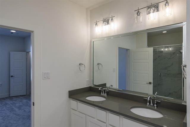 bathroom with vanity and a shower with shower door