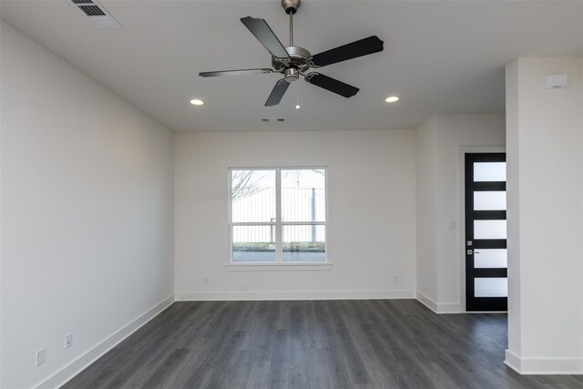 unfurnished room featuring ceiling fan and dark hardwood / wood-style floors