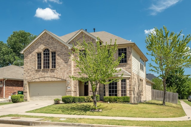 view of front of house with a garage and a front lawn