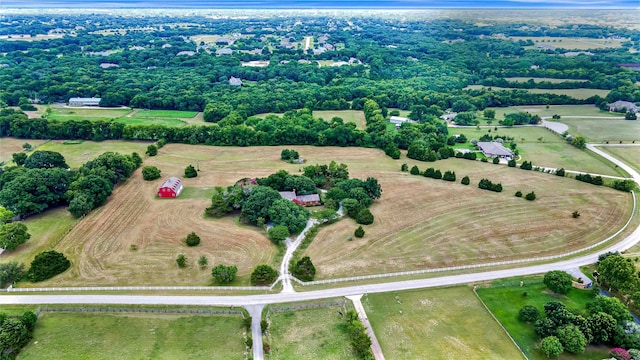 birds eye view of property with a rural view