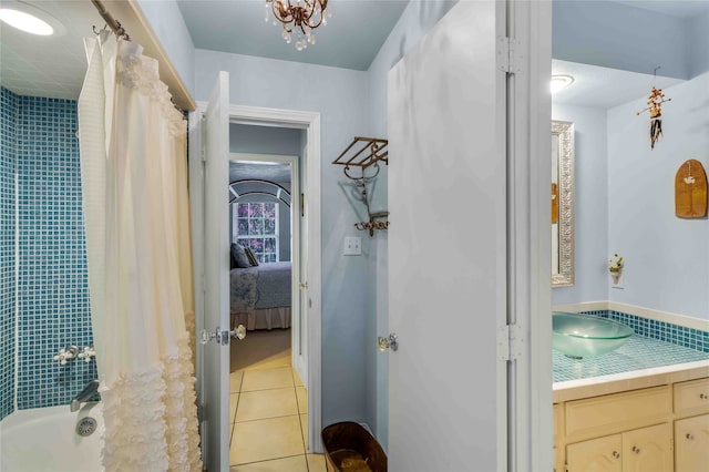 bathroom featuring shower / bath combo, vanity, ensuite bath, and tile patterned floors