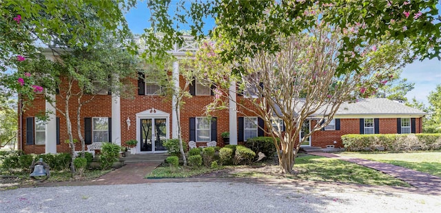 view of front of property featuring brick siding