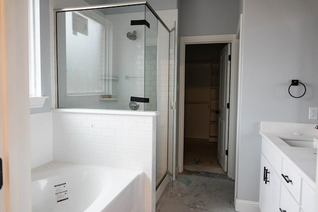 bathroom with vanity and plus walk in shower