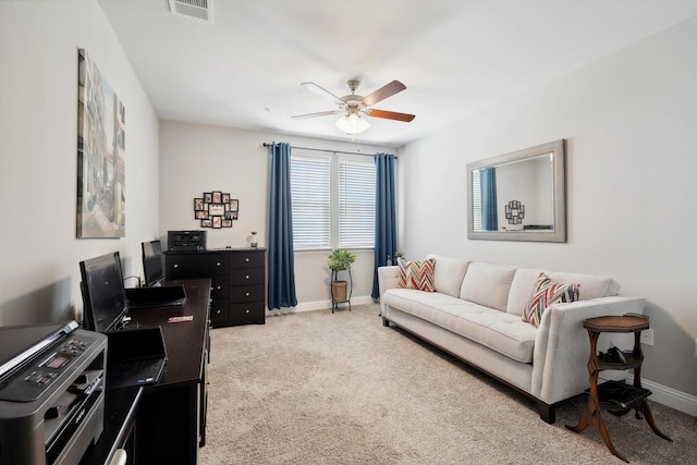 interior space with ceiling fan, visible vents, and baseboards