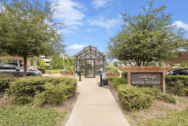 view of property's community featuring an outdoor structure and an exterior structure