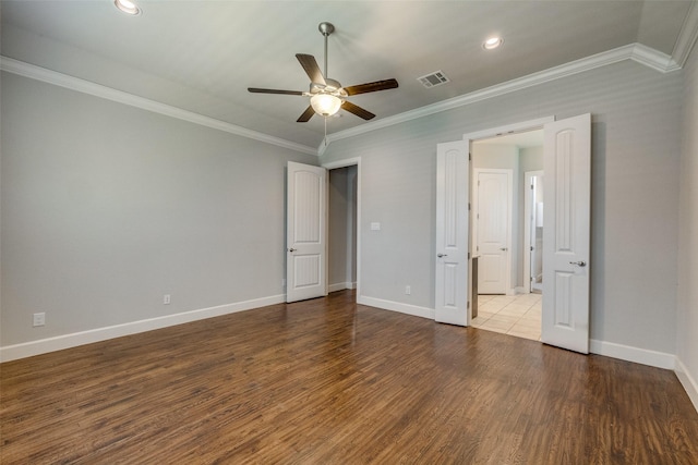 unfurnished bedroom with ceiling fan, ornamental molding, and wood-type flooring