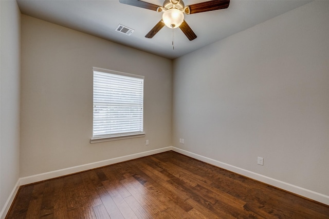 empty room featuring ceiling fan and dark hardwood / wood-style floors