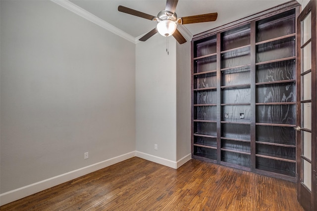 unfurnished room featuring dark hardwood / wood-style flooring, crown molding, and ceiling fan