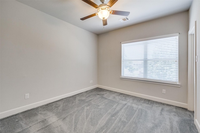 unfurnished room with carpet and ceiling fan