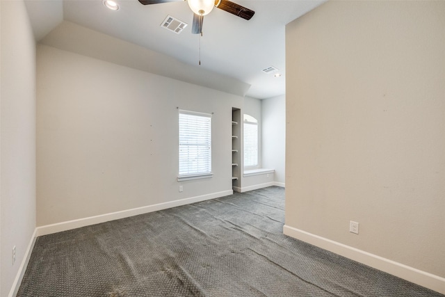 carpeted empty room featuring ceiling fan