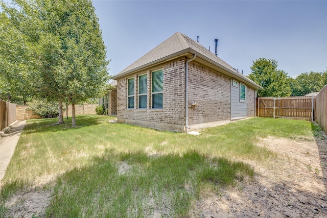 view of property exterior with a lawn