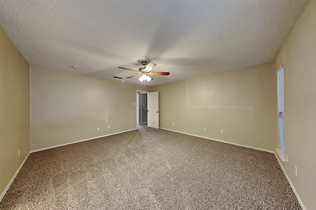 spare room featuring ceiling fan, a textured ceiling, and carpet flooring