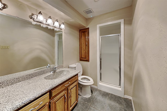 bathroom with a shower with shower door, vanity, toilet, and a textured ceiling