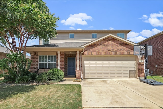 view of property with a garage and a front lawn