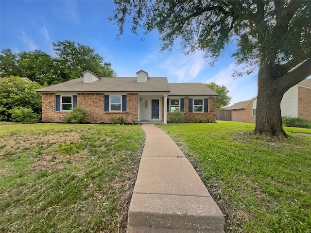 ranch-style house with a front lawn