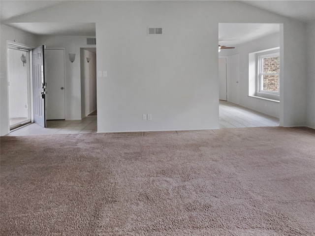 carpeted spare room featuring ceiling fan