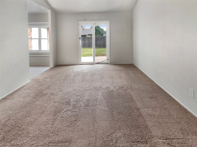 empty room featuring light carpet