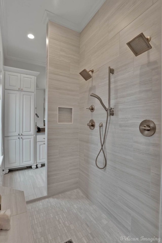 bathroom featuring tiled shower and tile patterned floors