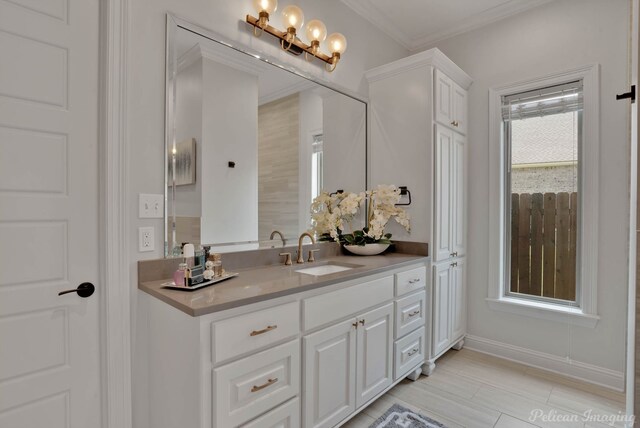 bathroom featuring vanity and ornamental molding