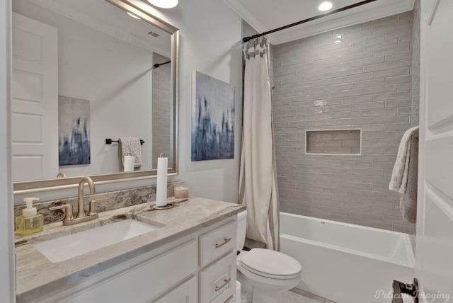 full bathroom featuring vanity, shower / bath combo with shower curtain, ornamental molding, and toilet