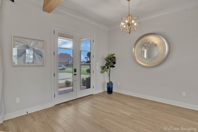 doorway featuring french doors, beam ceiling, crown molding, a chandelier, and light hardwood / wood-style floors