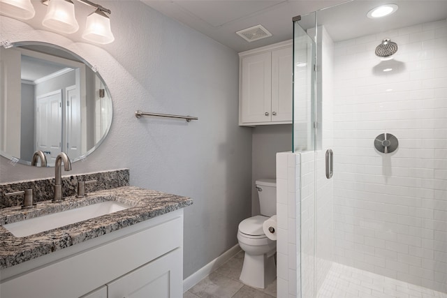 bathroom featuring vanity, toilet, tile patterned floors, and a shower with shower door