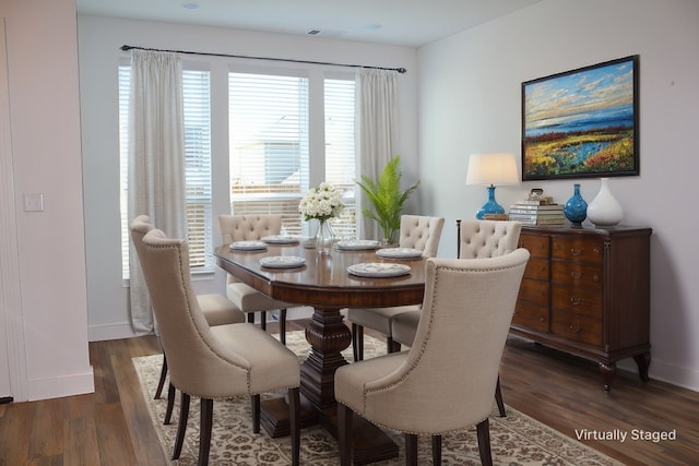 dining area with dark hardwood / wood-style floors