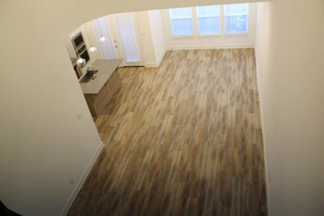 hallway featuring dark hardwood / wood-style flooring