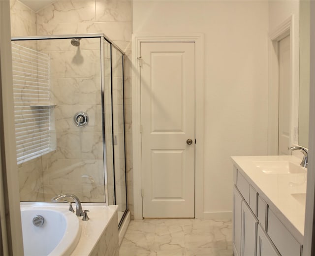 bathroom featuring vanity and independent shower and bath